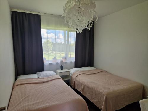 Una cama o camas en una habitación de Purjemaja