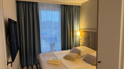 Postel nebo postele na pokoji v ubytování Apartament BELLA D126