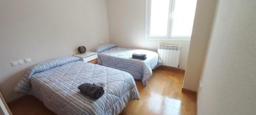 Katil atau katil-katil dalam bilik di Apartamento con 3 dormitorios y garaje a 10 minutos de Valladolid