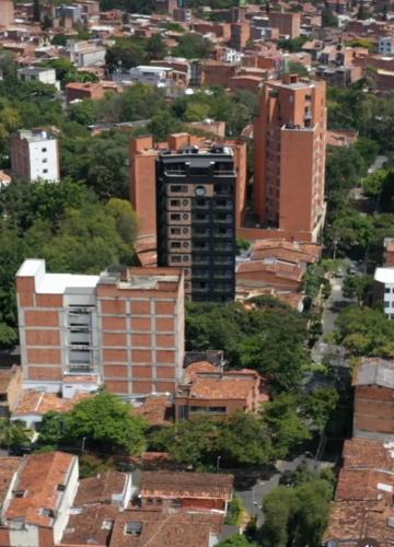 a view of a city with tall buildings at Hotel Living 35 Suites Piso 8 Vip in Medellín