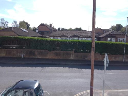 a car parked on the side of a street at Double or twin room in town centre in East Grinstead