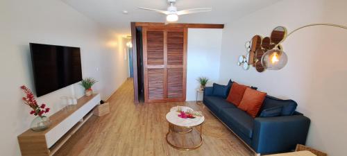 TV a/nebo společenská místnost v ubytování Appartement Karuk'Idîle - Vue Mer Exceptionnelle, à 200m de la Plage