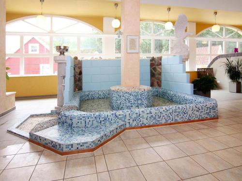 a jacuzzi tub in the middle of a room at Ferienhaus in Markgrafenheide in Markgrafenheide