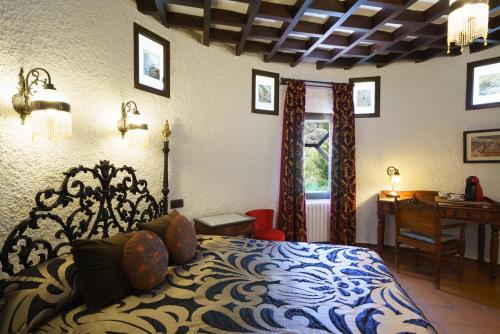 Postel nebo postele na pokoji v ubytování Hotel Rural Albamanjon