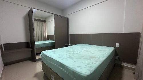 Ένα ή περισσότερα κρεβάτια σε δωμάτιο στο Hotel Park Veredas Flat Service