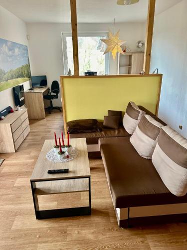 a living room with a couch and a table at Dolpo 5 in Benešov