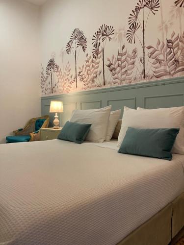 Ένα ή περισσότερα κρεβάτια σε δωμάτιο στο Axagua Hotel Boutique