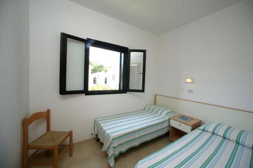 Rúm í herbergi á Centro Vacanze Oriente