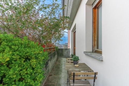 a balcony with two benches and a window at ElleBnb Busto city - MXP - Rho fiera con Wifi e Netflix in Busto Arsizio
