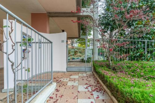 a walkway with a gate in front of a building at ElleBnb Busto city - MXP - Rho fiera con Wifi e Netflix in Busto Arsizio