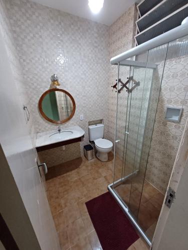 a bathroom with a shower and a sink and a toilet at Espaço Plataforma in Nova Friburgo
