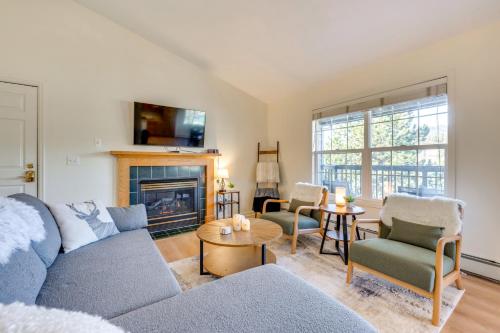 a living room with a couch and a fireplace at Walk to Downtown Mountain-View Estes Escape in Estes Park