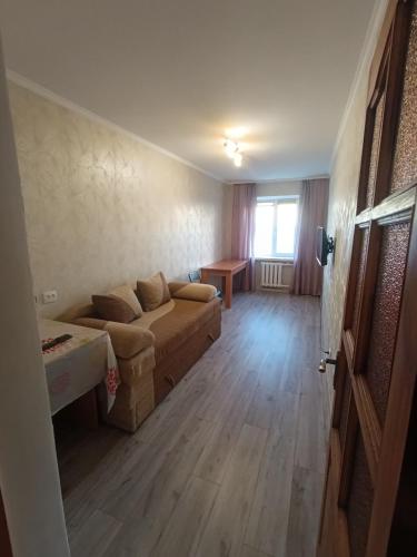 a living room with a couch and a table at Apartments near the Trinity Church on Dovzhenko Street,102 in Chernihiv