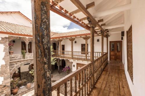 an external view of a house with a balcony at Casa Clara by Ananay Hotels in Cusco