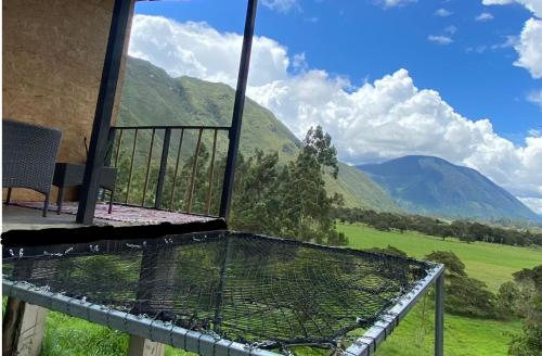 a balcony with a view of a mountain at Cabaña2 con hermosa vista al valle in Oxapampa