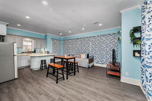 a kitchen and living room with a table and chairs at Spacious 1-BR Midtown Houston Apt with King Bed & Free Parking in Houston