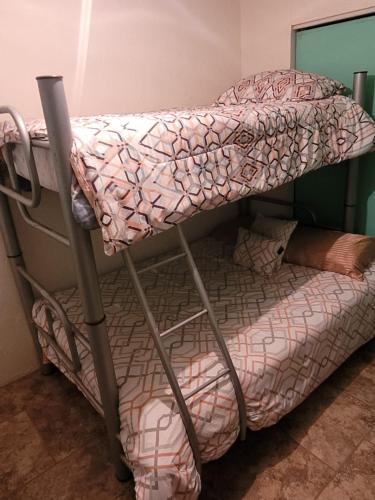 Ένα ή περισσότερα κρεβάτια σε δωμάτιο στο Sweet Home at Juarez