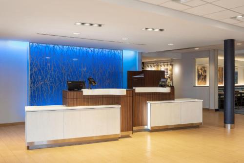 an office with a blue wall and a reception desk at Fairfield Inn & Suites by Marriott Columbus Dublin in Dublin