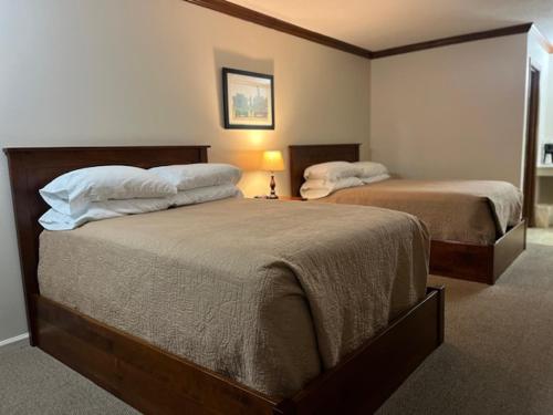 a bedroom with two beds in a room at Arthur Country Inn in Arthur