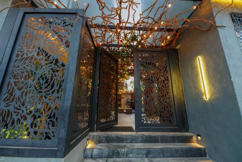 an entrance to a house with a wrought iron gate at El Edén in Zipolite
