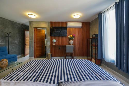 a bedroom with a large bed in a room at El Edén in Zipolite