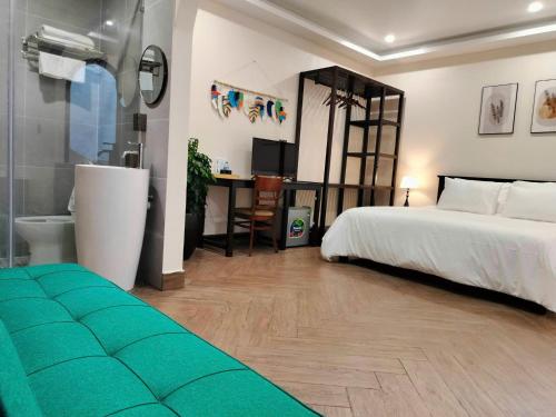 Ένα ή περισσότερα κρεβάτια σε δωμάτιο στο Camellia Garden Hotel