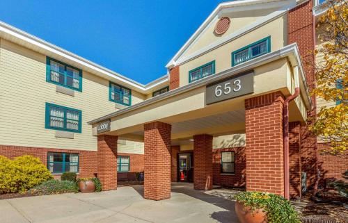a building with a sign on the front of it at Extended Stay America Suites - Rockford - I-90 in Rockford