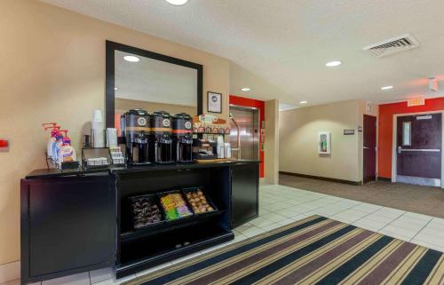 a lobby with a mirror and a food counter at Extended Stay America Suites - Rockford - I-90 in Rockford