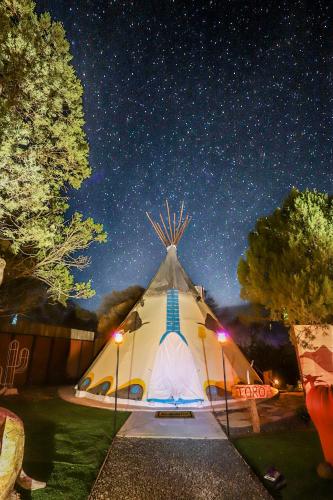 a large white tent under a night sky with stars at Toro Tipi at El Mistico Ranch in Nogal