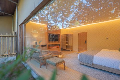 Cama o camas de una habitación en ホテル郷