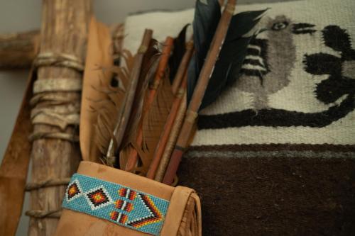 a wallet with a bunch of chopsticks in a holder at Oso Tipi at El Mistico Ranch in Nogal