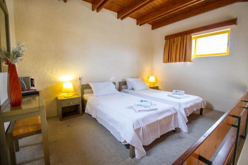 Ένα ή περισσότερα κρεβάτια σε δωμάτιο στο Lycasti Maisonettes