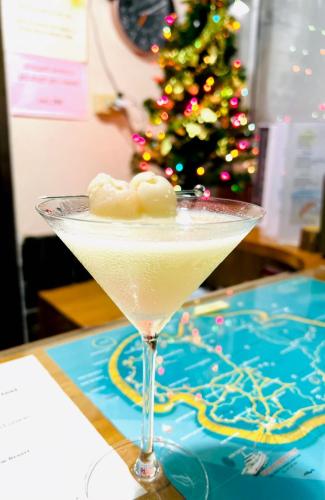 a christmas martini sitting on a table with a christmas tree at Rin Bay View Resort in Haad Rin