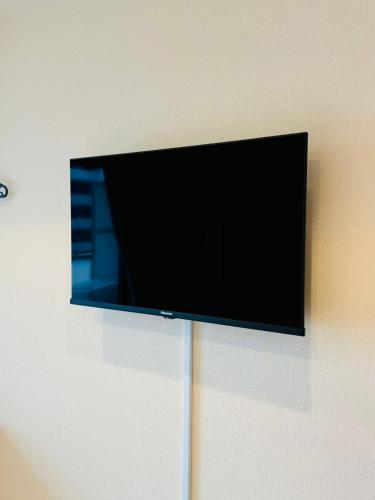 TV a/nebo společenská místnost v ubytování 中央公馆 Central Mansions 地下鉄谷町六丁目徒步1分心斎橋駅天王寺駅まで電車1本