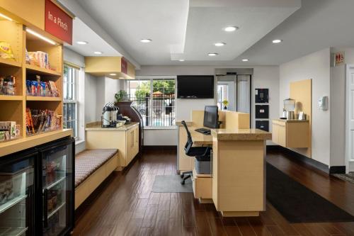an office with a desk and a computer in it at TownePlace Suites Salt Lake City Layton in Layton