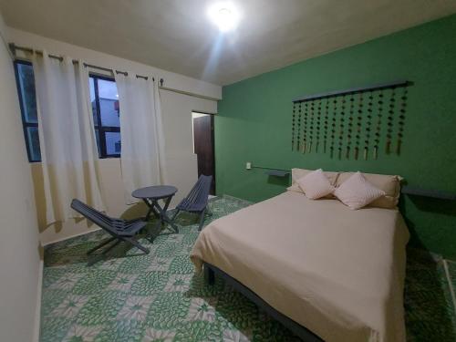 Ένα ή περισσότερα κρεβάτια σε δωμάτιο στο Casa Luna Hospedaje