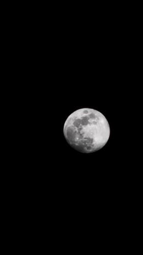 a moon in the sky at night at Cliff Canvas in Mount Ābu