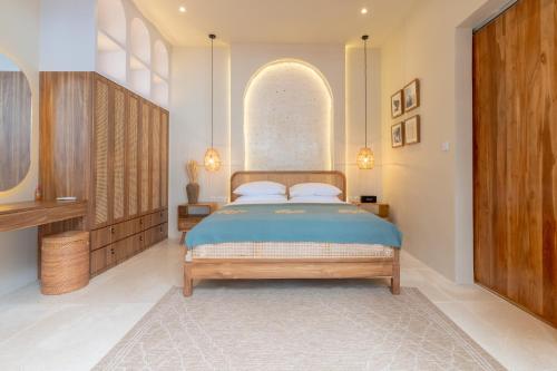 a bedroom with a bed and a large window at Solid Surf Villa Mentawai in Tuapejat