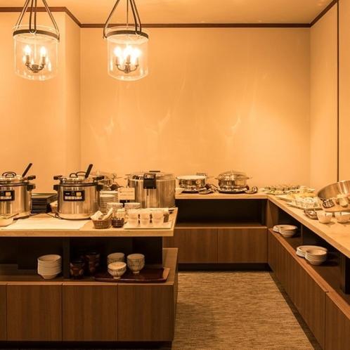 a kitchen with a counter with pots and pans at Hotel Odashima in Morioka