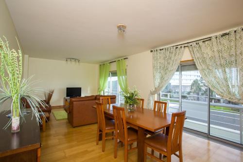 a dining room with a table and chairs at Apartment T3 in Downtown with Sea View in Ponta Delgada