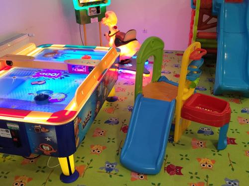 a childs play room with a pool table at Chata Belez in Dolný Kubín