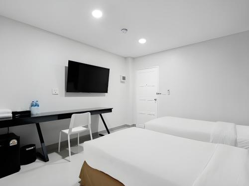 Μια τηλεόραση ή/και κέντρο ψυχαγωγίας στο Terminal2 Hotel Phukettown