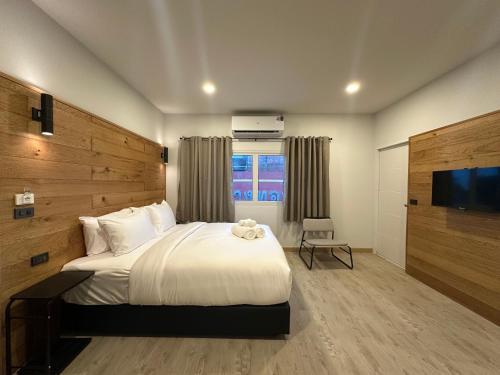 Ένα ή περισσότερα κρεβάτια σε δωμάτιο στο EbS Residence Chaweng