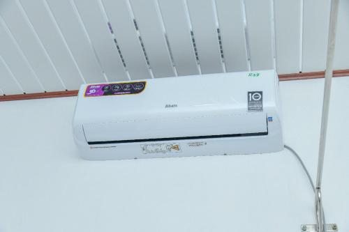 a white printer sitting on top of a shelf at Turtle cove residence in Tangalle
