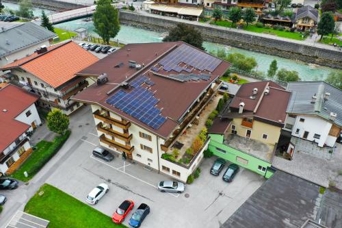 an overhead view of a house with solar panels on it at Hotel Englhof in Zell am Ziller