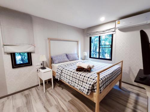 Postel nebo postele na pokoji v ubytování Title Residencies Naiyang 2 Bedrooms PoolAccess
