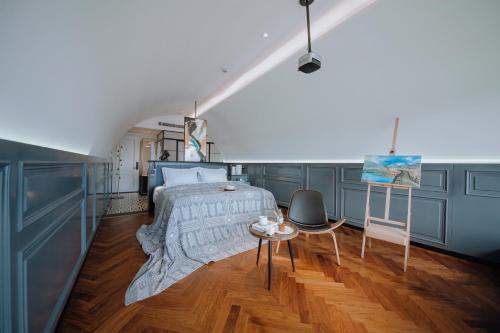 a bedroom with a bed and a table at Lakeside Retreat - LuguLake Lijiang in Zuosuo