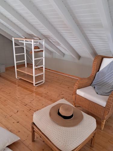 a hat sitting on a coffee table in a living room at Asos Luxury Seafront Villas, Kefalonia, 100m beach & center, 4 stars services, Parking - near Myrtos - Fiskardo in Asos