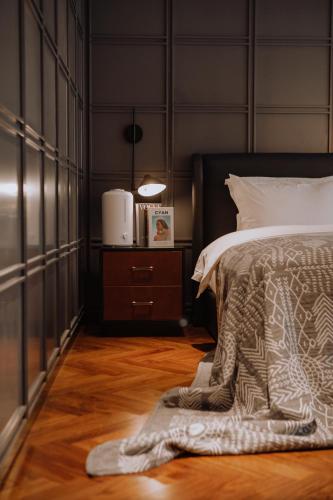 a bedroom with a bed with a blanket on the floor at Lakeside Retreat - LuguLake Lijiang in Zuosuo