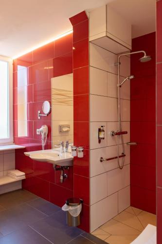 Un baño de Logis Hotel Des Vosges